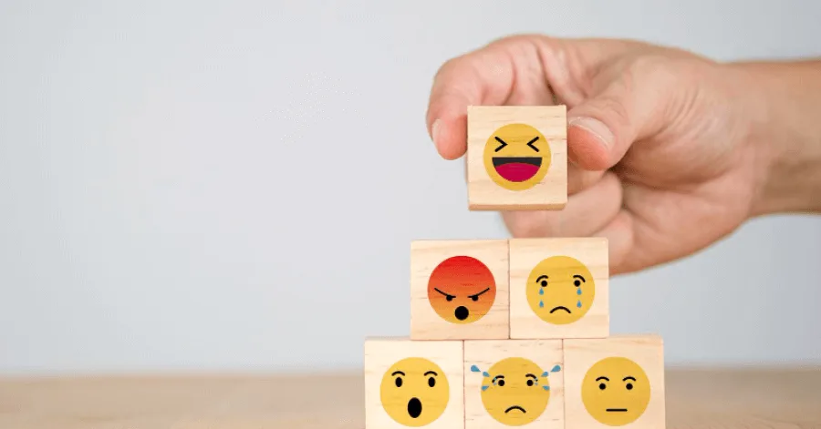 Wooden square blocks with different emojis