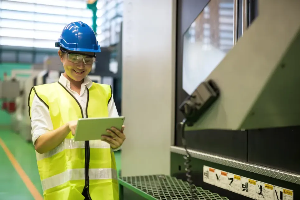 A machine technician answering her survey on a tablet in her own language